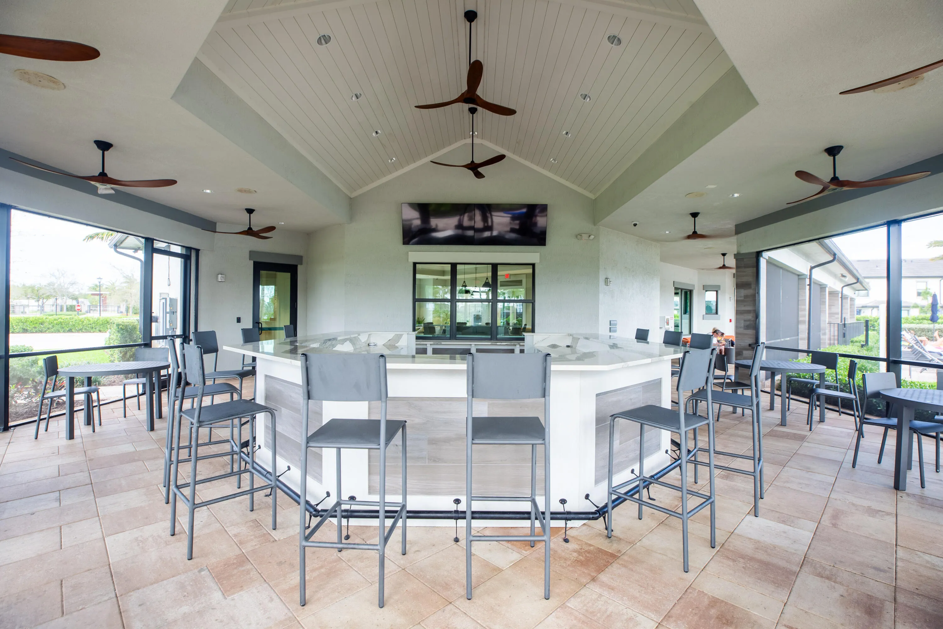 Outdoor screened patio with bar area