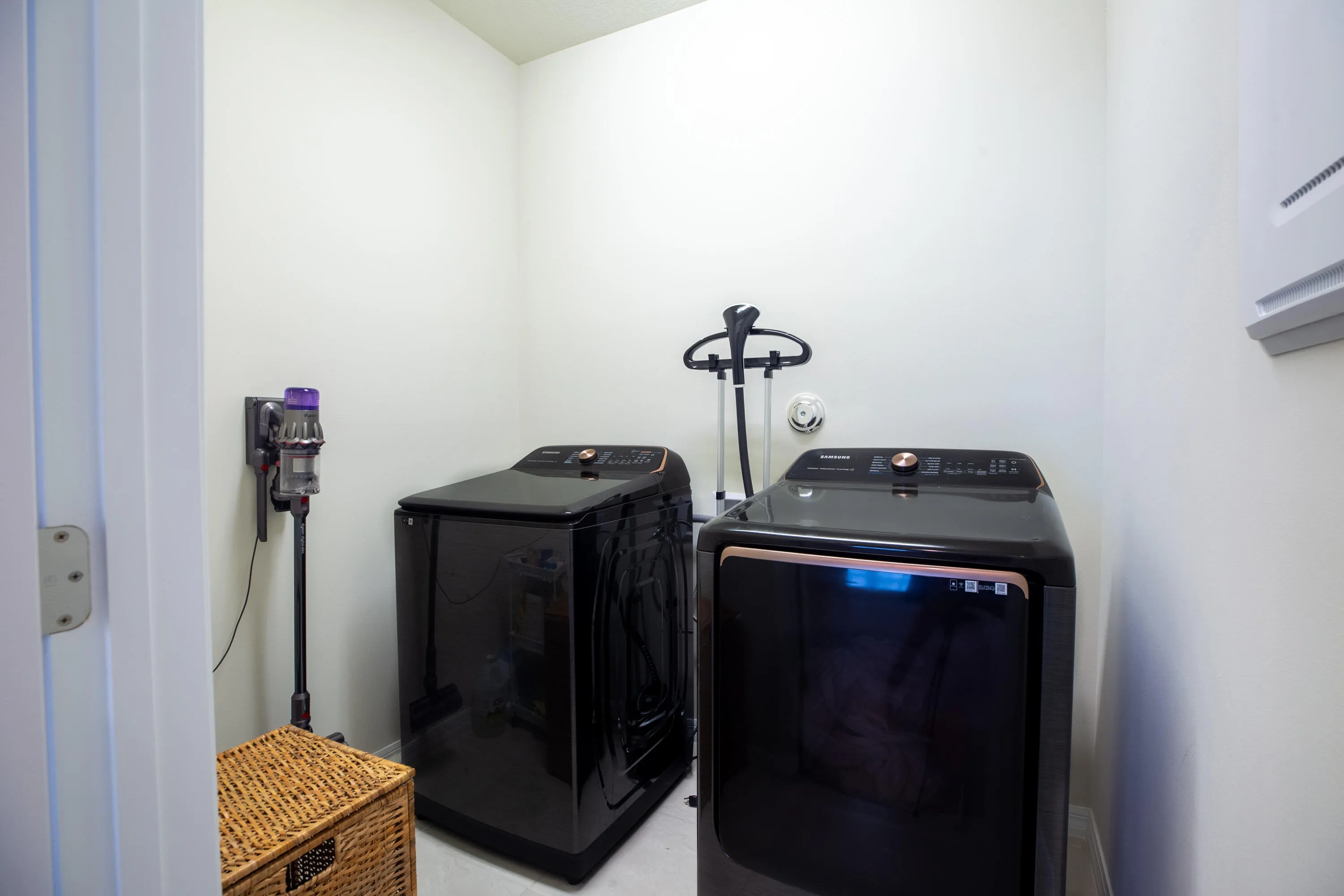 Laundry room with newer Samsung washer and gas dryer