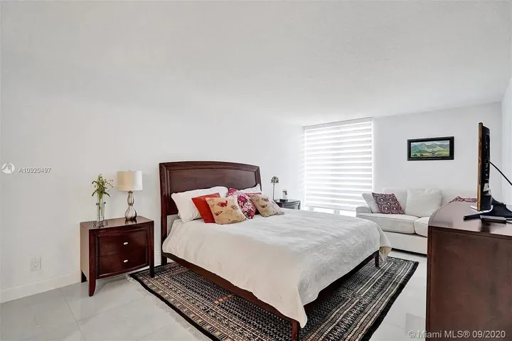 Large master ensuite with walk in closet with wall to wall shelves, drawers & hanging space.