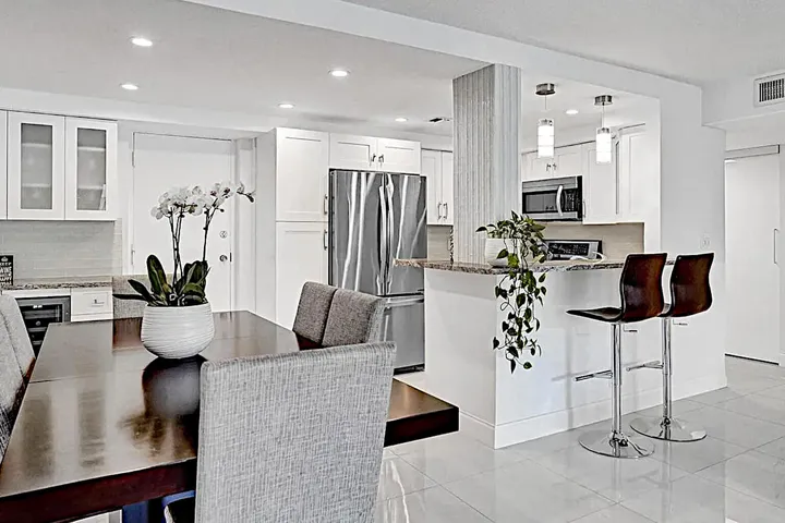 Granite countertops, wine cooler, unique hardware.