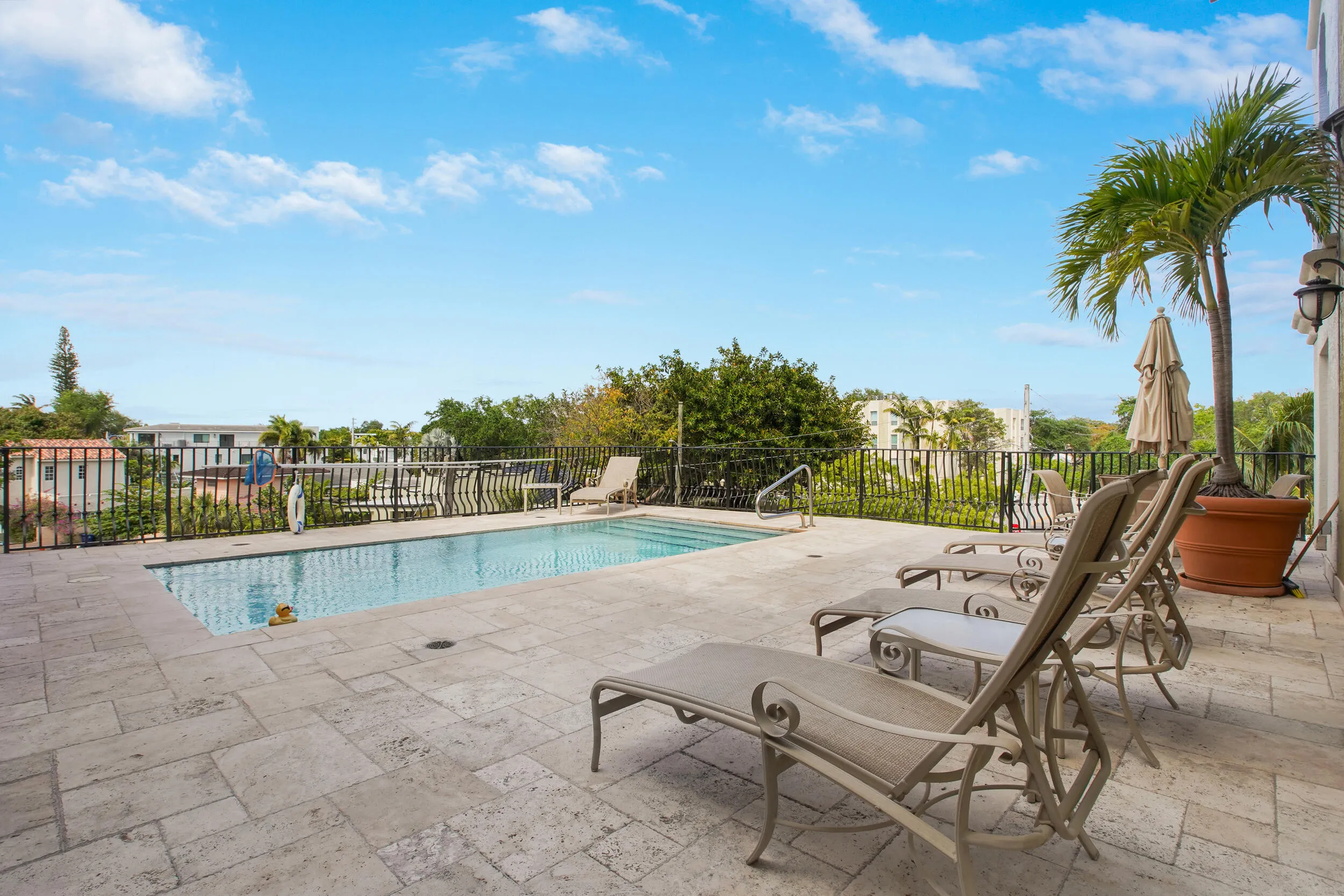 Community Rooftop Pool with a Swim Spa feature for resistance swimming