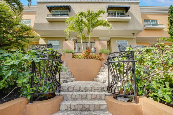 Up the staircase on the right leads to the front door (Front entry level also available by elevator)