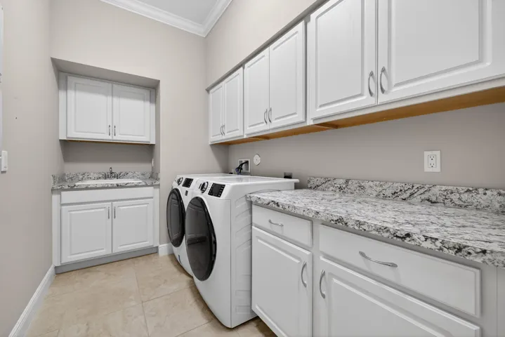LARGE LAUNDRY ROOM WITH CABINETS