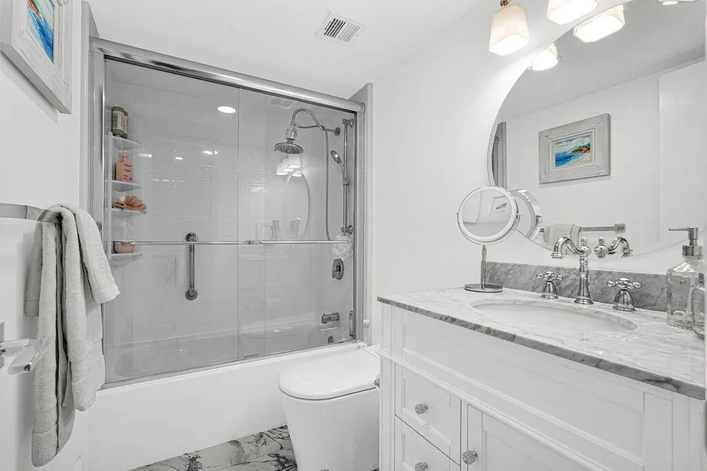 Remodeled 2nd bath with glass shower doors and quartz countertops