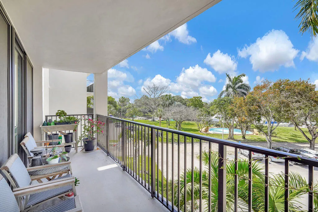 Large covered balcony looking towards fountain and canal.
