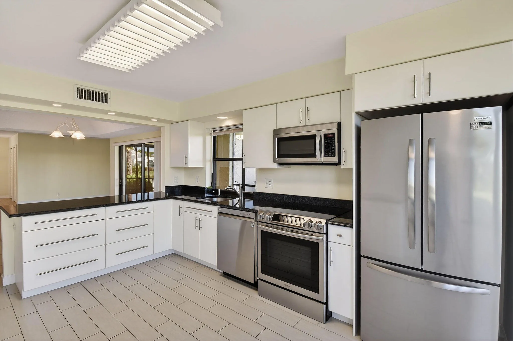 Kitchen overlooking dining area and living room