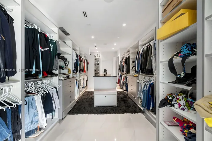 Master bedroom walk-in closet with dual access from bedroom or master bathroom