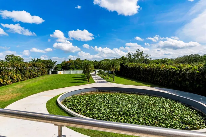 Front open terrace overlooking circular driveway lily pond