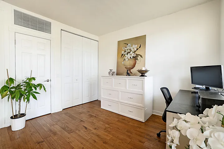 Private ground-level suite with full bath and closet—offering flexible use as a 4th bedroom, guest retreat, office, den, or fitness space