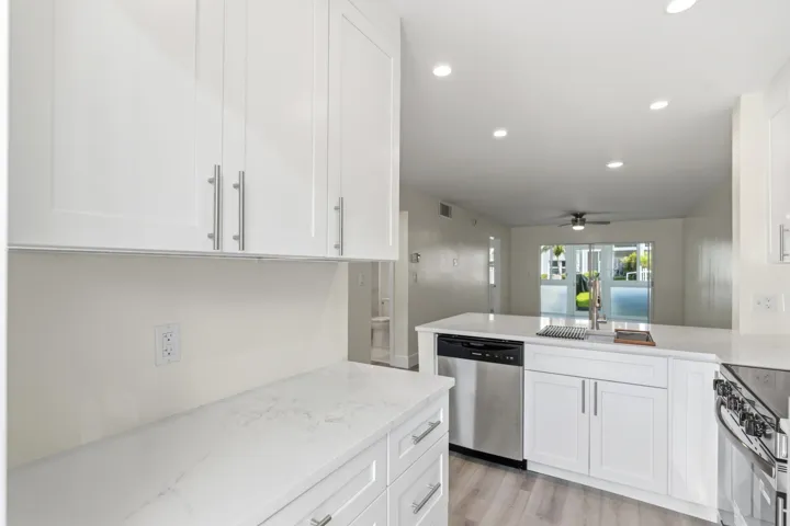A brand NEW custom kitchen with quartz countertops, Eat in Bar, soft-close cabinets, stainless-steel appliances and ALL NEW ELECTRIC, PLUMBING, AC, AND HWH!