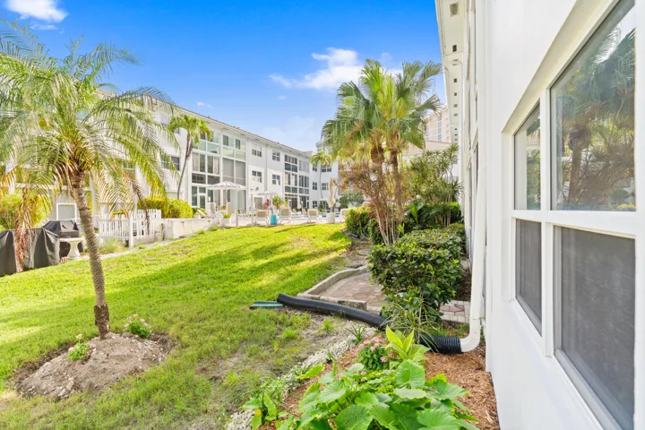 IMPACT GLASS ENCLOSED PATIO WITH DIRECT ACCESS TO COURTYARD POOL, BBQ AREA, SHUFFLEBOARD, AND CANAL BREEZEWAY.
