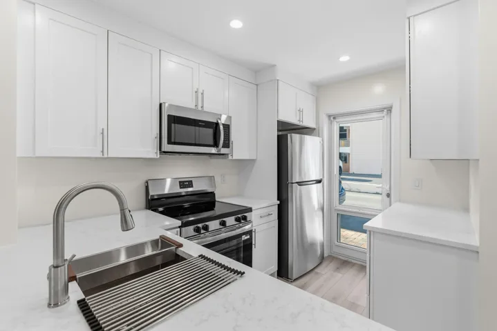 A brand NEW custom kitchen with quartz countertops, Eat in Bar, soft-close cabinets, stainless-steel appliances and ALL NEW ELECTRIC, PLUMBING, AC, AND HWH!