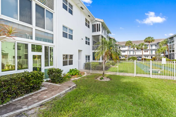 IMPACT GLASS ENCLOSED PATIO WITH DIRECT ACCESS TO COURTYARD POOL, BBQ AREA, SHUFFLEBOARD, AND CANAL BREEZEWAY.