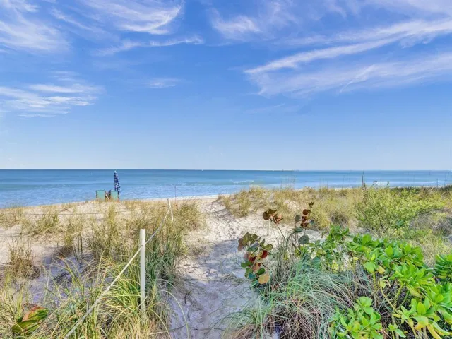BEACH AND BOAT LOVERS DREAM LOCATION!.., FEATURING PRIVATE DEEDED BEACH ACCESS, COMMUNITY BOAT DOCK, NO FIXED BRIDGES, 1 CANAL FROM THE INTRACOASTAL WITH 6 BOAT SLIPS! Located in desirable North Leisure Gardens COMPLETELY REMODELED 2-bed, 2-bath, 1st floor, corner unit features EVERYTHING BRAND NEW!, a custom kitchen with quartz countertops, soft-close cabinets, stainless-steel appliances and ALL NEW, ELECTRIC, PLUMBING, HWH AND AC UNIT.