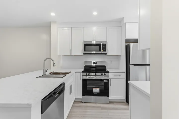 A brand NEW custom kitchen with quartz countertops, Eat in Bar, soft-close cabinets, stainless-steel appliances and ALL NEW ELECTRIC, PLUMBING, AC, AND HWH!