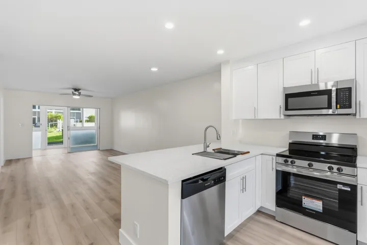 A brand NEW custom kitchen with quartz countertops, Eat in Bar, soft-close cabinets, stainless-steel appliances and ALL NEW ELECTRIC, PLUMBING, AC, AND HWH!