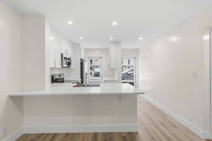 A brand NEW custom kitchen with quartz countertops, Eat in Bar, soft-close cabinets, stainless-steel appliances and ALL NEW ELECTRIC, PLUMBING, AC, AND HWH!