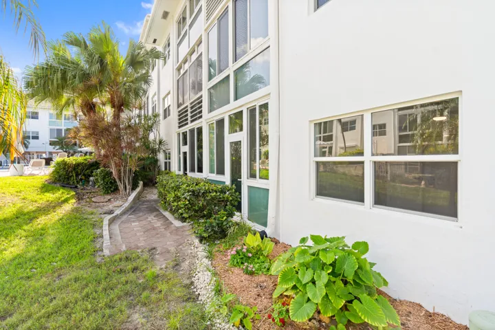 IMPACT GLASS ENCLOSED PATIO WITH DIRECT ACCESS TO COURTYARD POOL, BBQ AREA, SHUFFLEBOARD, AND CANAL BREEZEWAY.