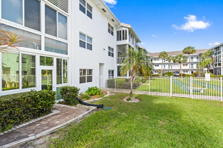 IMPACT GLASS ENCLOSED PATIO WITH DIRECT ACCESS TO COURTYARD POOL, BBQ AREA, SHUFFLEBOARD, AND CANAL BREEZEWAY.