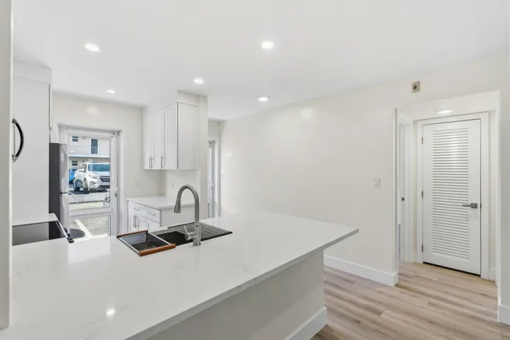 A brand NEW custom kitchen with quartz countertops, Eat in Bar, soft-close cabinets, stainless-steel appliances and ALL NEW ELECTRIC, PLUMBING, AC, AND HWH!