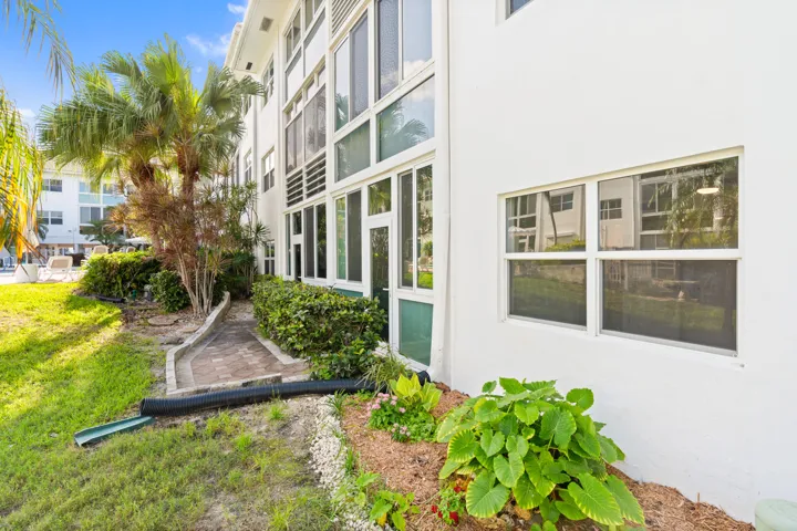 IMPACT GLASS ENCLOSED PATIO WITH DIRECT ACCESS TO COURTYARD POOL, BBQ AREA, SHUFFLEBOARD, AND CANAL BREEZEWAY.