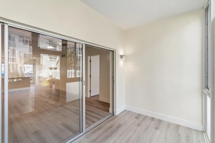 IMPACT GLASS ENCLOSED PATIO WITH DIRECT ACCESS TO COURTYARD POOL, BBQ AREA, SHUFFLEBOARD, AND CANAL BREEZEWAY.