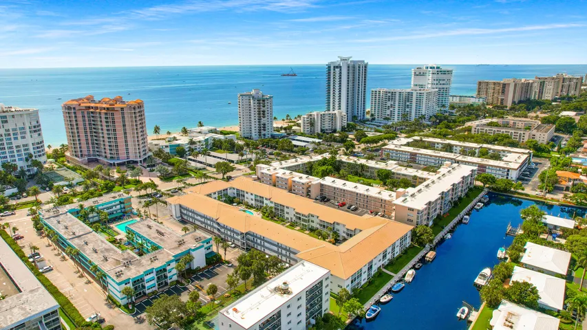 BEACH AND BOAT LOVERS DREAM LOCATION!.., FEATURING PRIVATE DEEDED BEACH ACCESS, COMMUNITY BOAT DOCK, NO FIXED BRIDGES, 1 CANAL FROM THE INTRACOASTAL WITH 6 BOAT SLIPS! Located in desirable North Leisure Gardens COMPLETELY REMODELED 2-bed, 2-bath, 1st floor, corner unit features EVERYTHING BRAND NEW!, a custom kitchen with quartz countertops, soft-close cabinets, stainless-steel appliances and ALL NEW, ELECTRIC, PLUMBING, HWH AND AC UNIT.