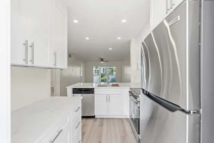 A brand NEW custom kitchen with quartz countertops, Eat in Bar, soft-close cabinets, stainless-steel appliances and ALL NEW ELECTRIC, PLUMBING, AC, AND HWH!