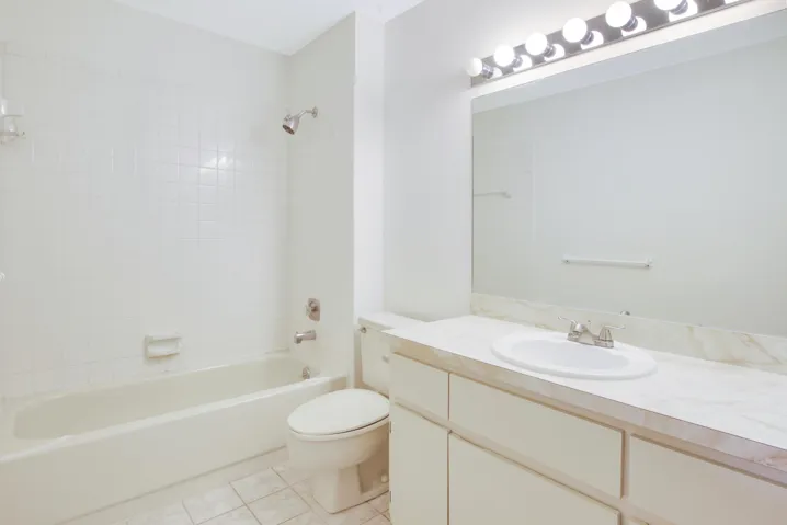 The upstairs guest bathroom is located just outside of bedroom 2 and features a tub/shower.