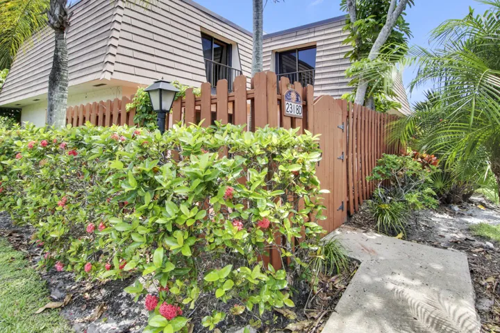 Enter through the gate to the unit's private patio.