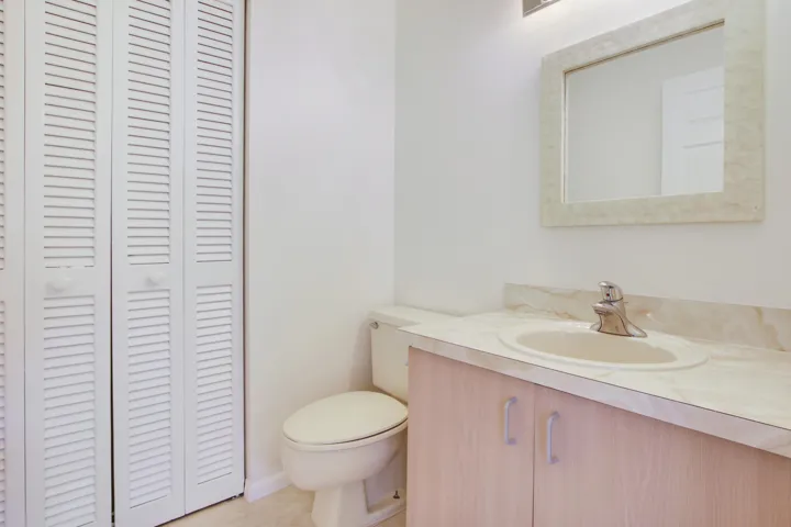 The unit offers a half bath with storage closet on the first floor.
