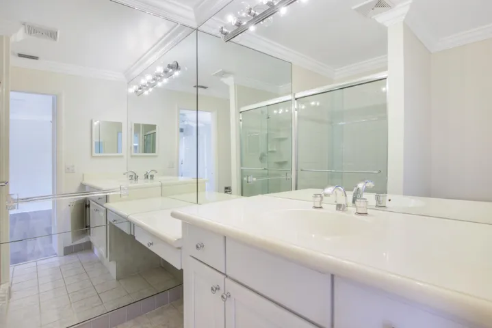 The master bathroom features a walk in shower.