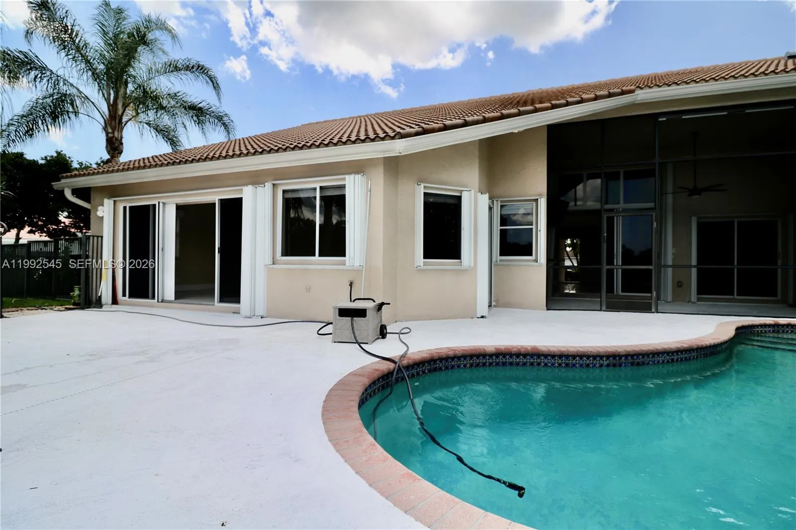 House back view, screened porch, pool