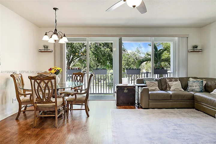 Stainless steel appliances/granite countertops with counter seating.