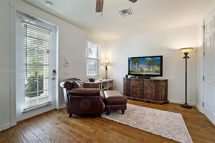 Open floor plan with balcony doors