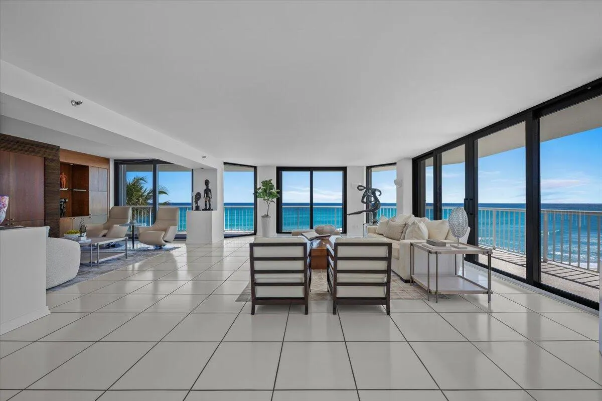Floor to ceiling impact glass doors span the residence, bright and airy ambiance