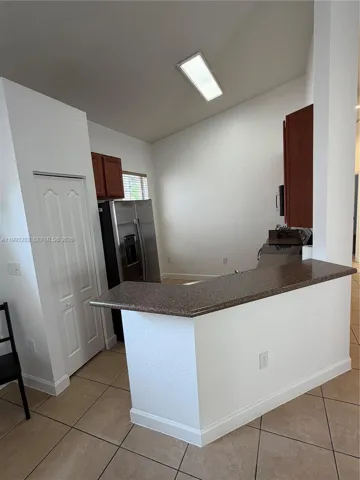 There is space in the kitchen for a breakfast nook>