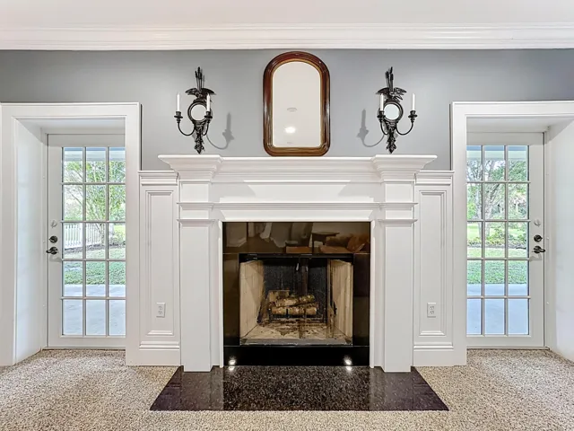 Double doors out to back porch and wood-burning fireplace