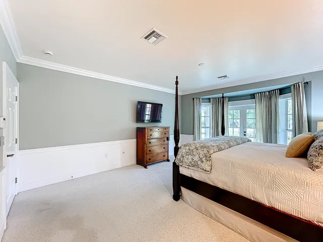 Primary Suite with French doors leading to covered back porch