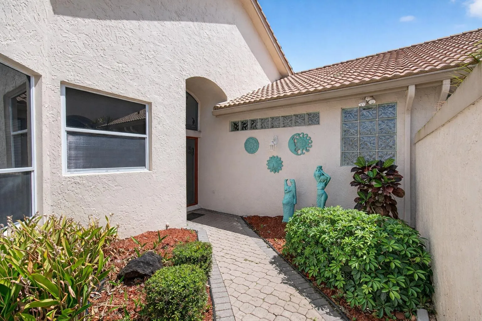 Inviting entrance with tropical decor