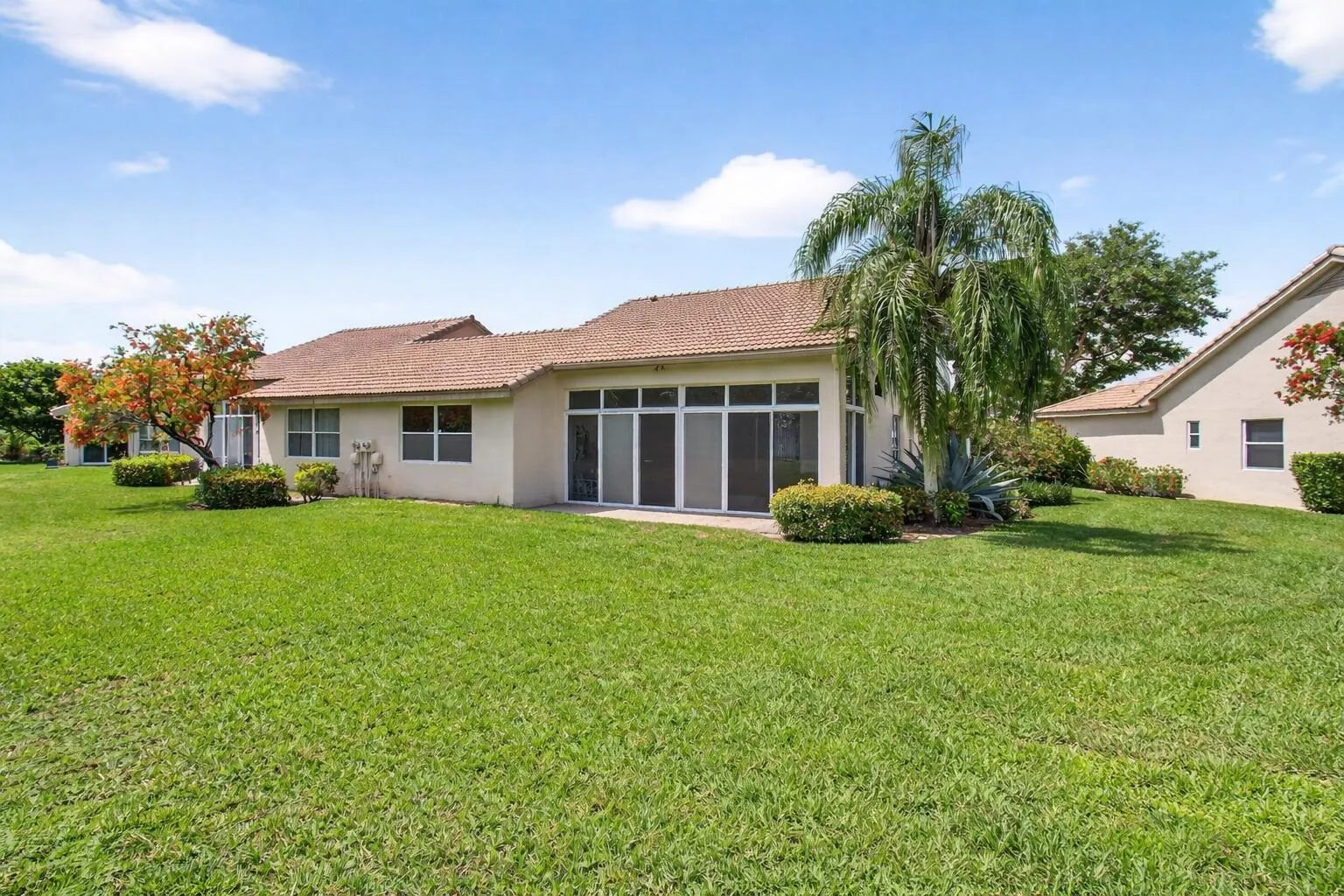 Sunny Florida backyard with lanai
