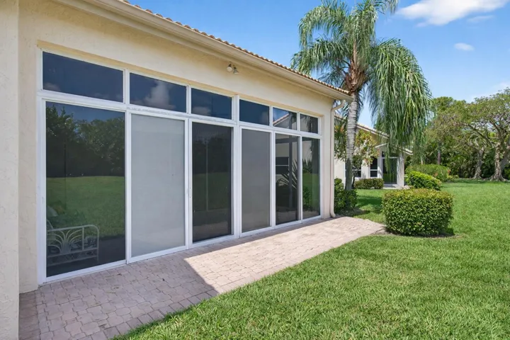 Bright patio with palm tree shadow