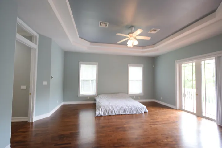 Primary suite with a king sized mattress for scale