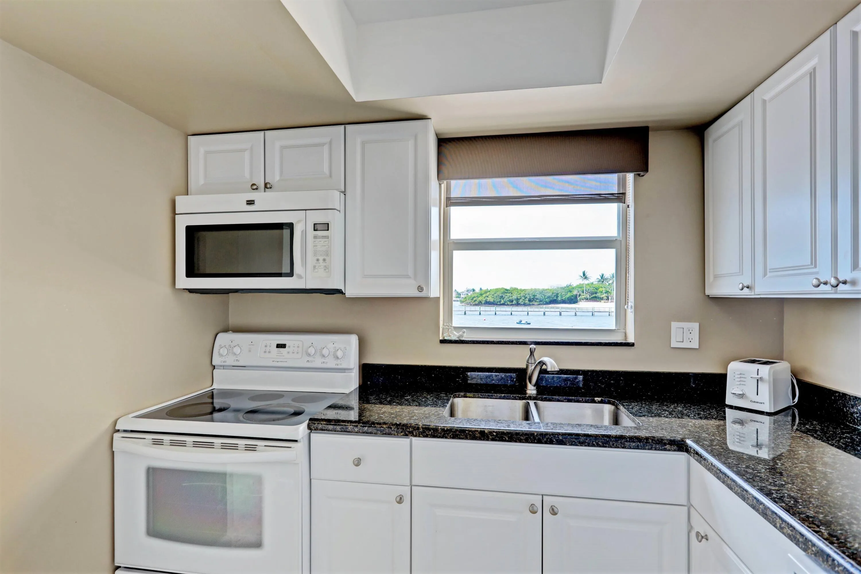 Kitchen window views pool & intercoastal