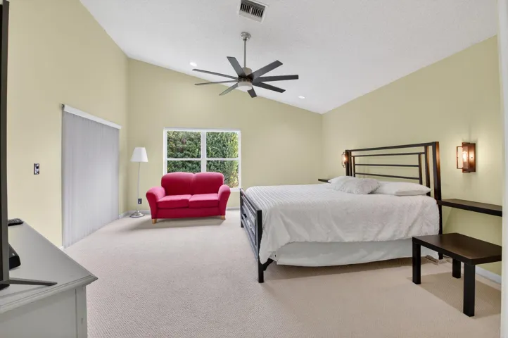 PRIMARY BEDROOM WITH SEATHING AND LANAI ACCESS