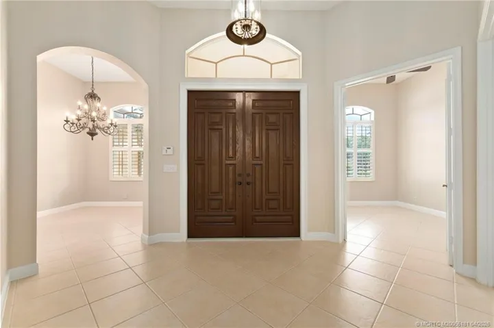Foyer with formal dining on left and office on right