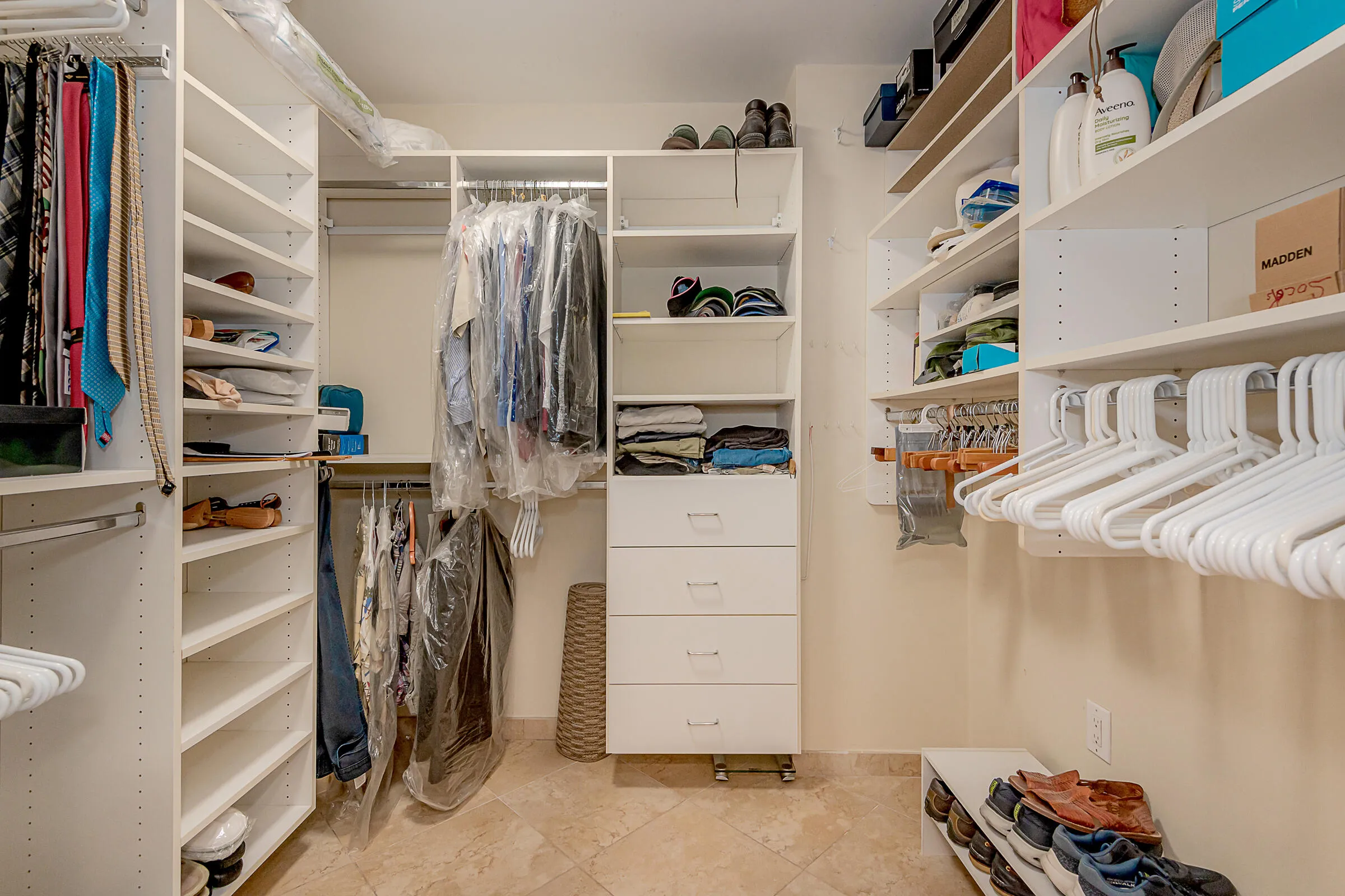 PRIMARY BEDROOM WALK IN CUSTOM CLOSET