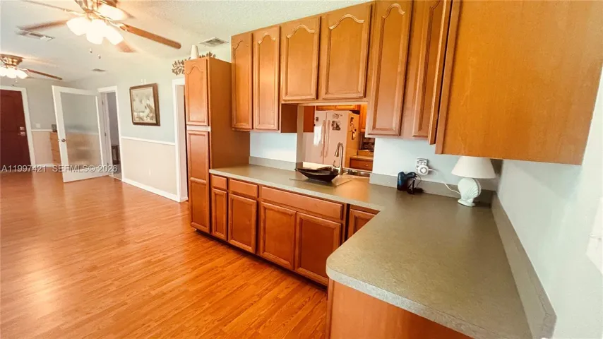 Extra cabinetry in Florida Room with kitchen pass thru!