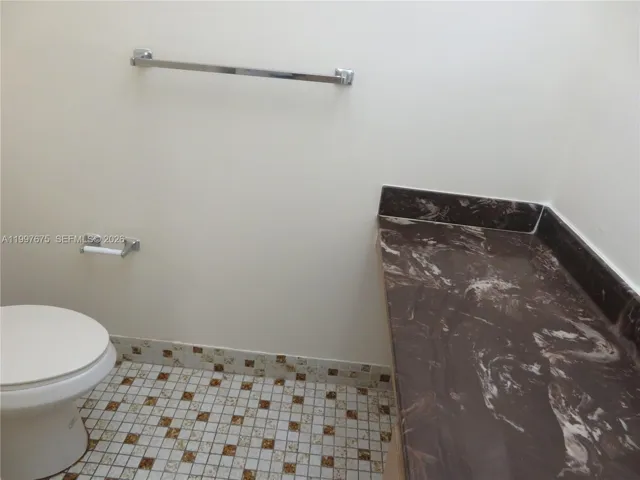 1/2 bath with sink and toilet for guests