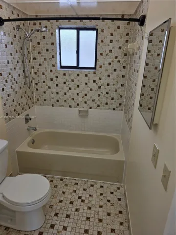 with tub and brand new toilet just installed